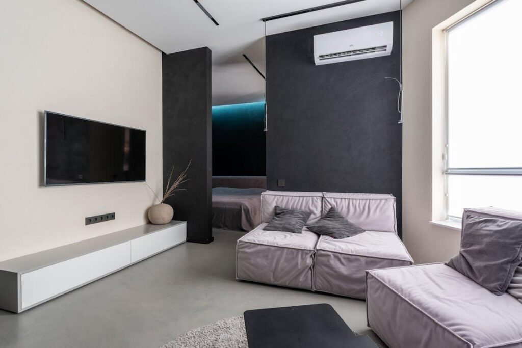 A wall-mounted air conditioning unit installed in a modern living room