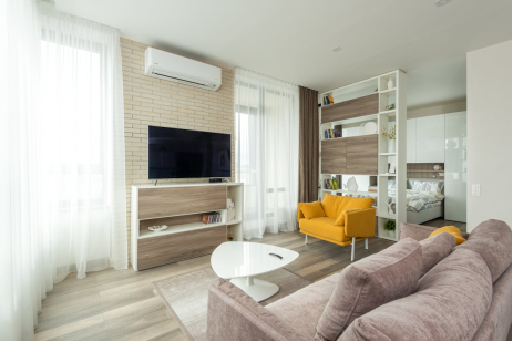 Modern living room with a wall-mounted air conditioner