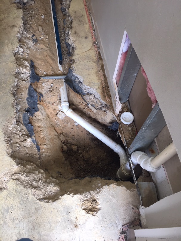 Plumbers fixing sewer problems