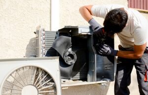 A person standing with AC repair